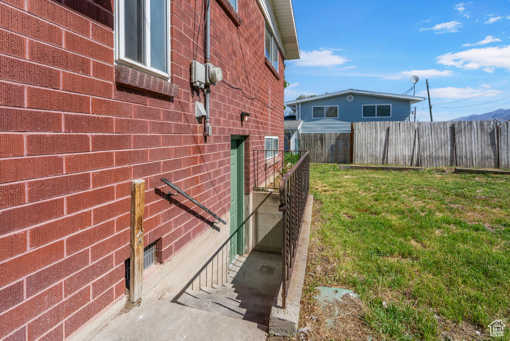 View of side of home with brick siding