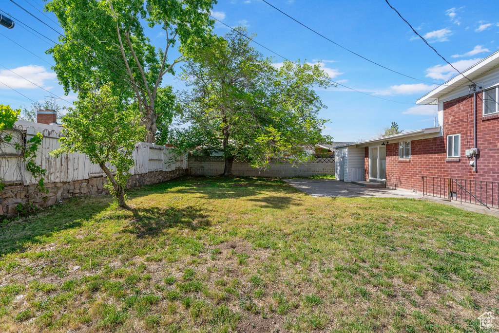 View of yard with a patio area