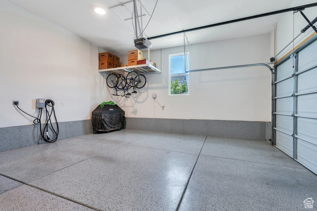 Garage featuring a garage door opener