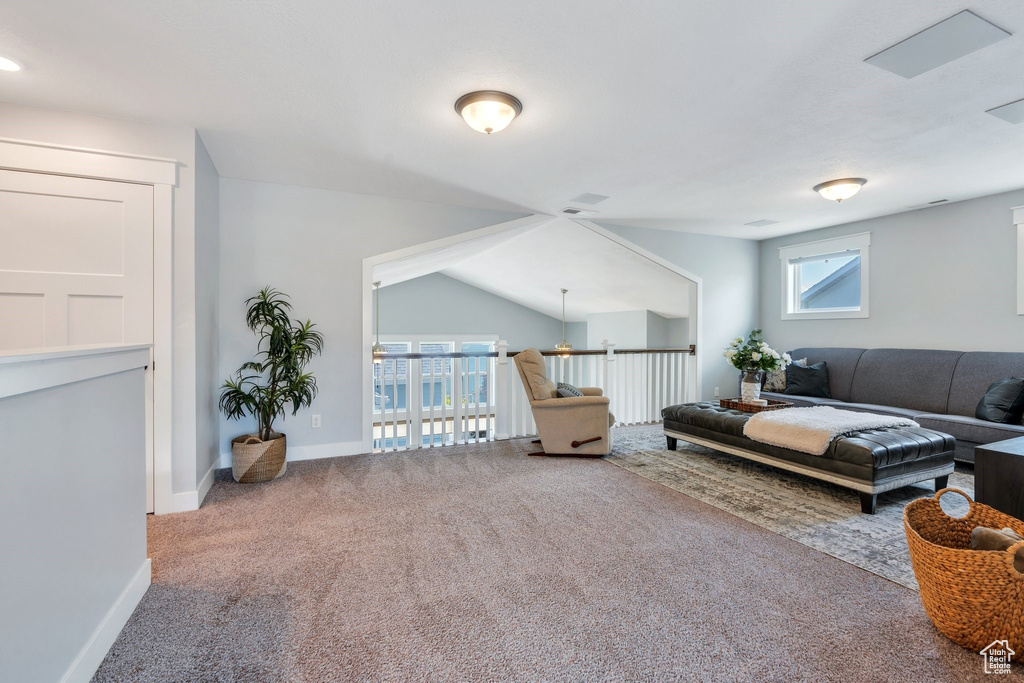 Living room featuring carpet flooring and baseboards