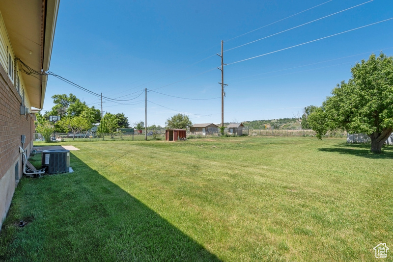 View of yard featuring cooling unit