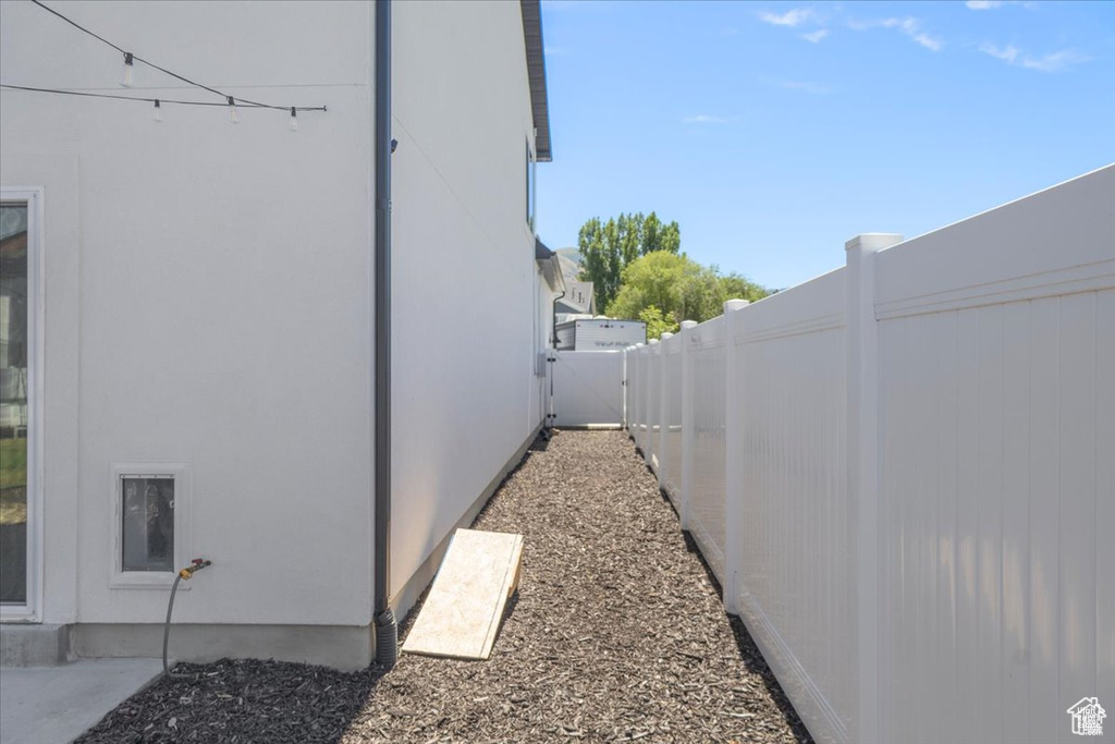 View of home's exterior with a fenced backyard and stucco siding