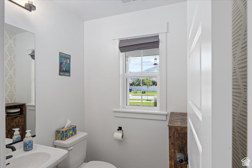 Bathroom featuring toilet and a sink