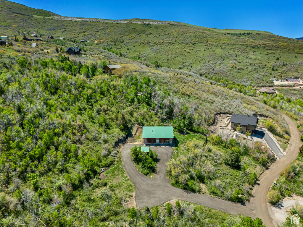 Aerial view of property\'s location featuring mountains