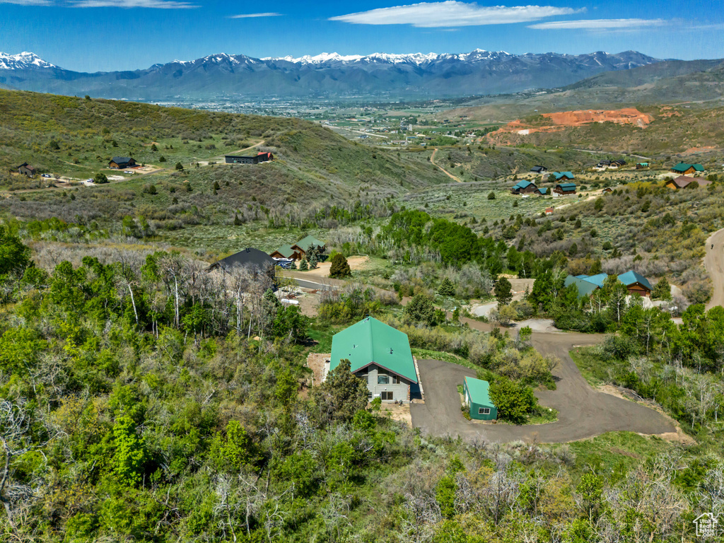 View of subject property featuring mountains