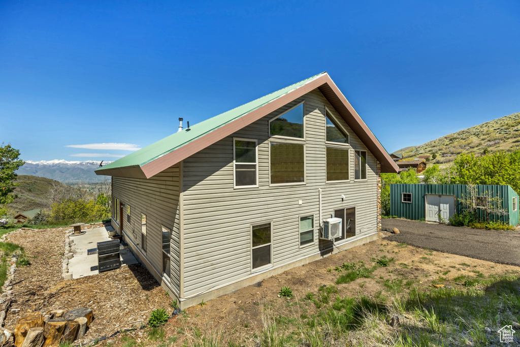 Back of property featuring a mountain view