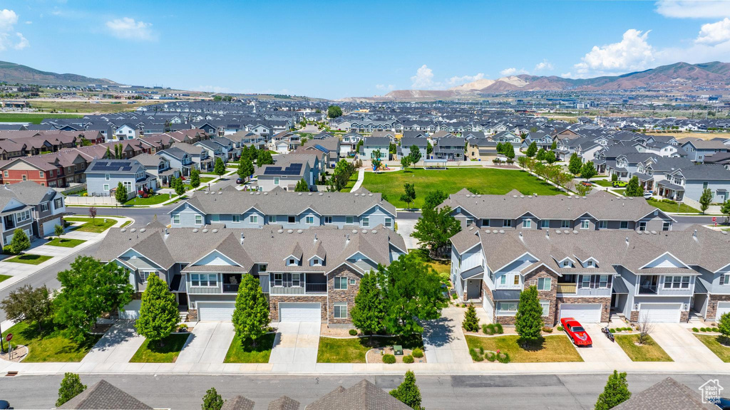 Aerial view of residential area featuring mountains