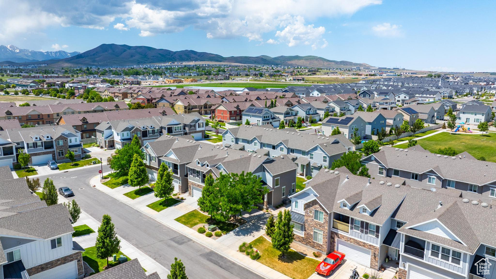 Aerial perspective of suburban area with a mountainous background