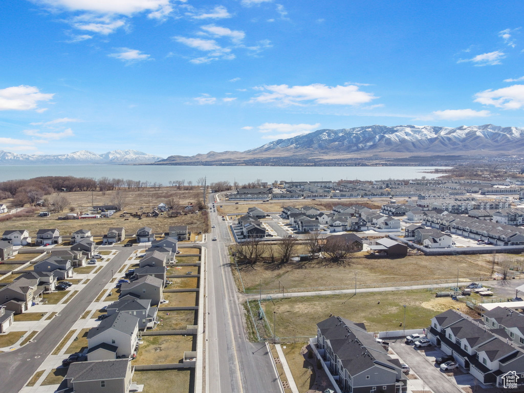 Aerial perspective of suburban area with a water and mountain view