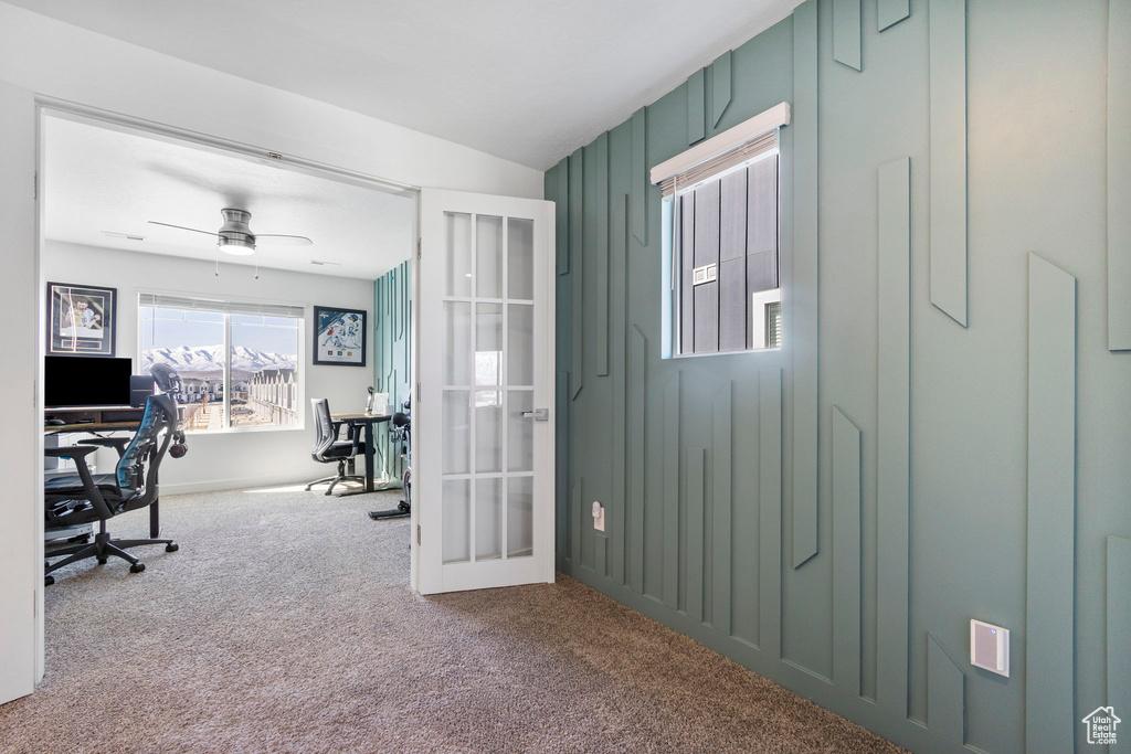 Home office featuring carpet flooring, french doors, and a ceiling fan