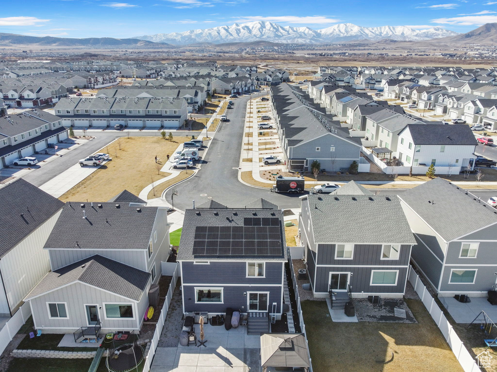 Aerial perspective of suburban area with a mountainous background