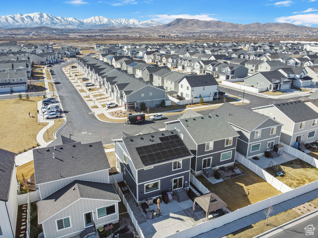 Aerial view of residential area featuring a mountain backdrop