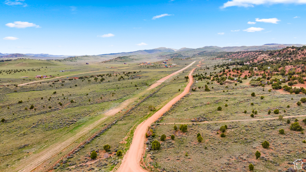 Overview of rural landscape featuring a mountainous background