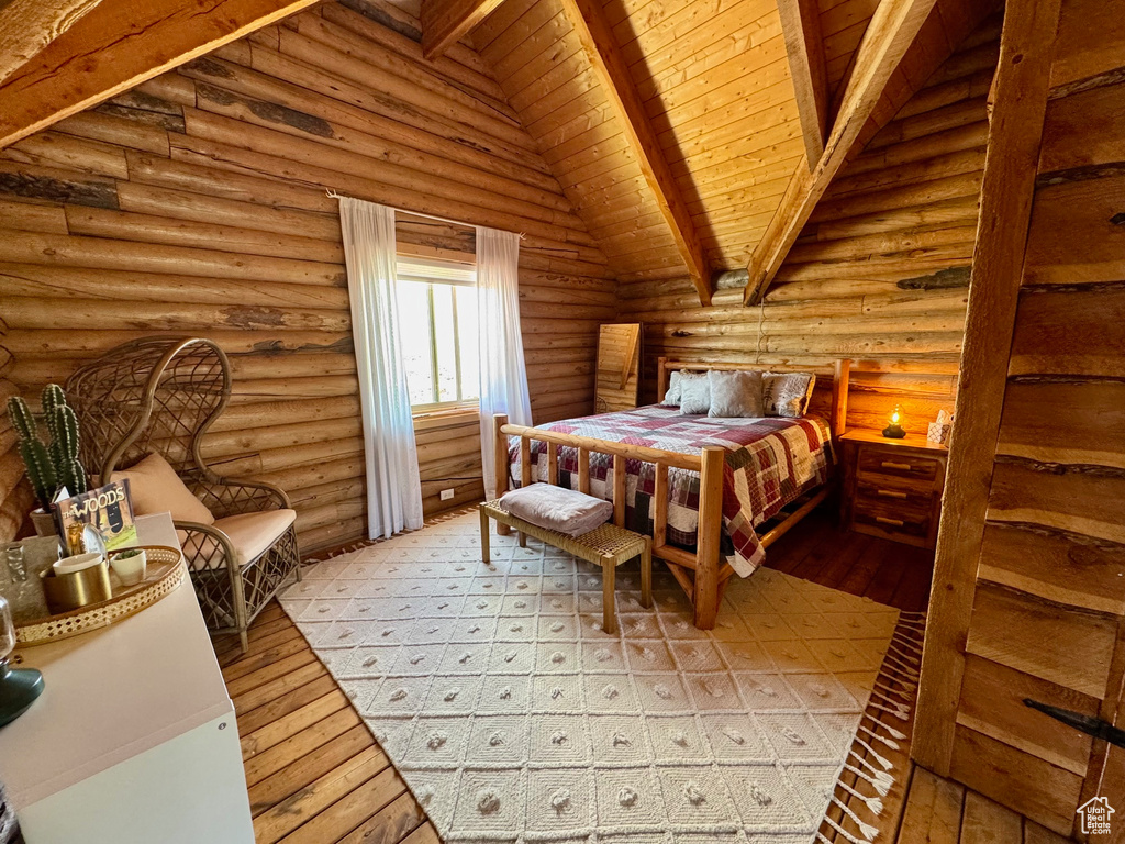 Bedroom with light wood-type flooring, log walls, and wood ceiling