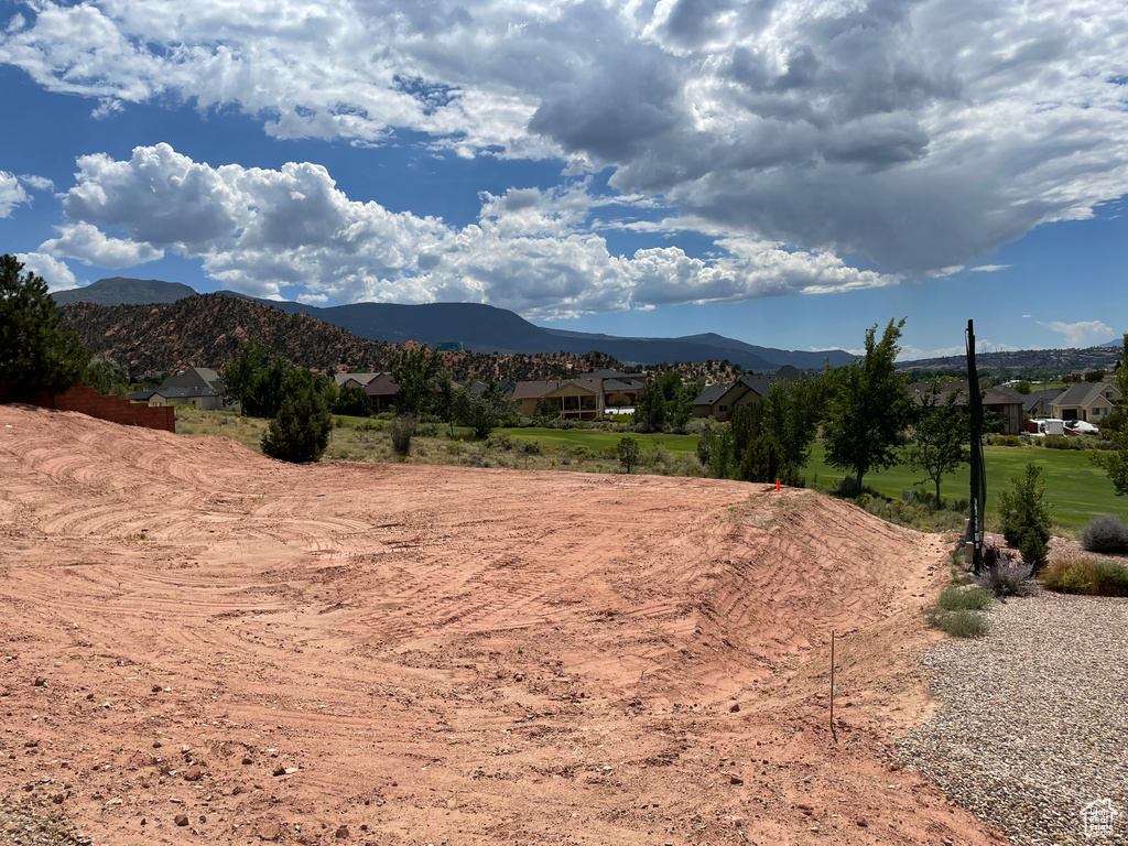 View of mountain background featuring nearby suburban area