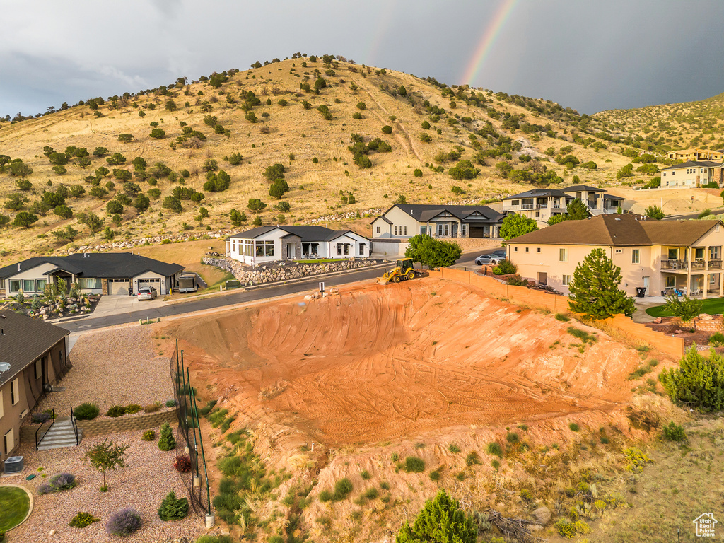 View of mountain backdrop featuring nearby suburban area