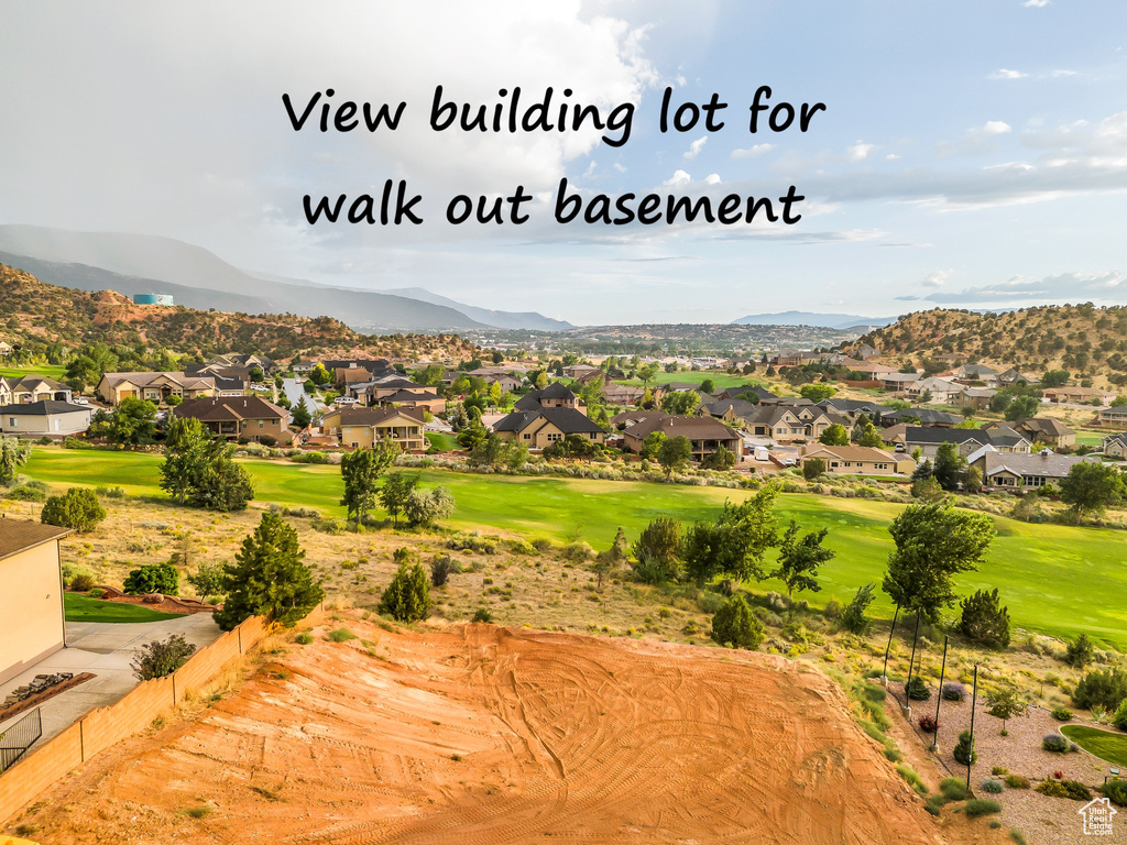 Mountain view with nearby suburban area and a golf club