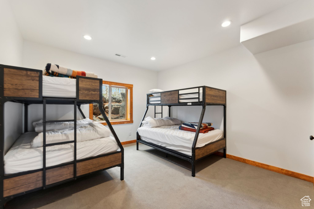 Bedroom with baseboards, light carpet, and recessed lighting