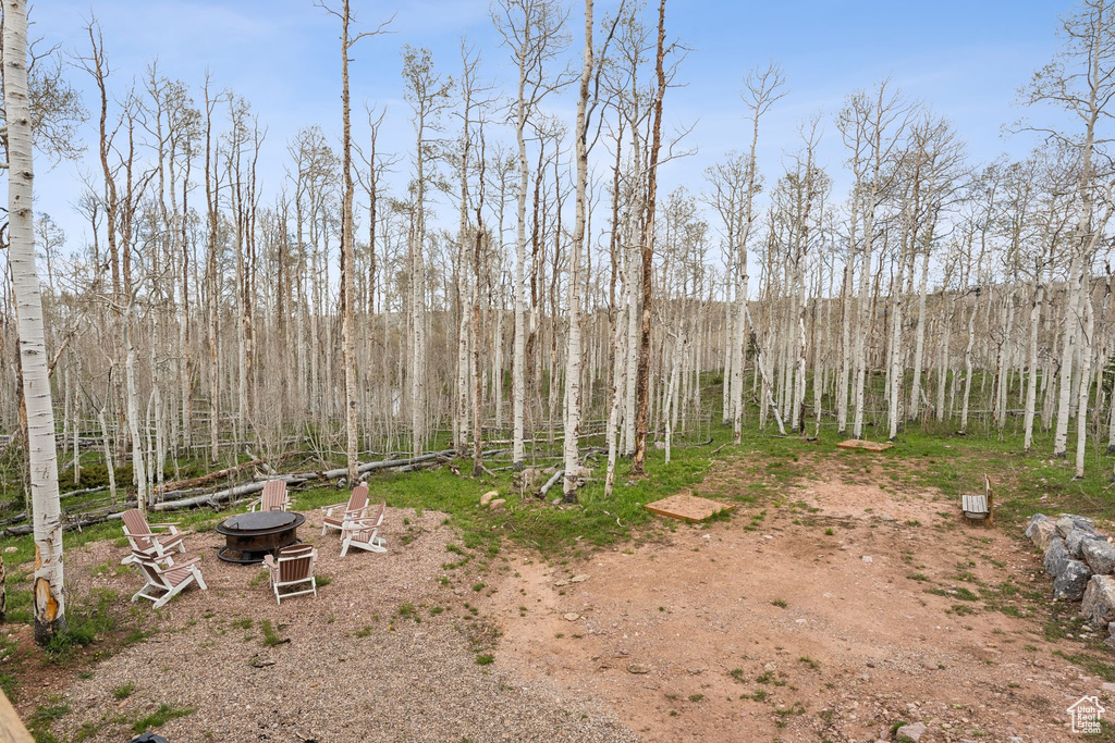 View of yard featuring a fire pit