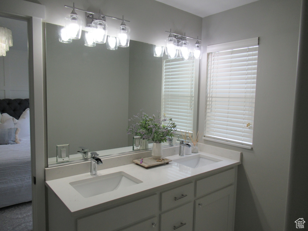 Bathroom with double vanity and connected bathroom
