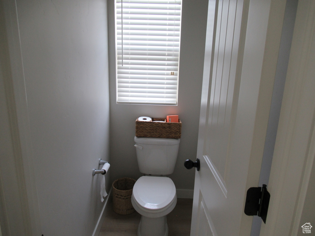 Bathroom with baseboards and toilet