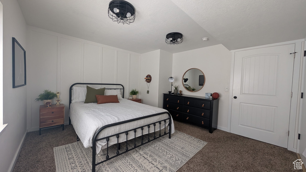 Bedroom with carpet and baseboards