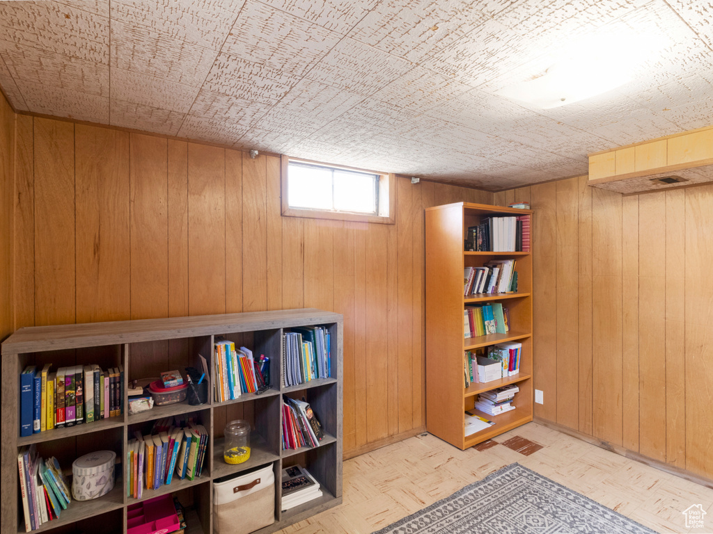 Sitting room with wood walls