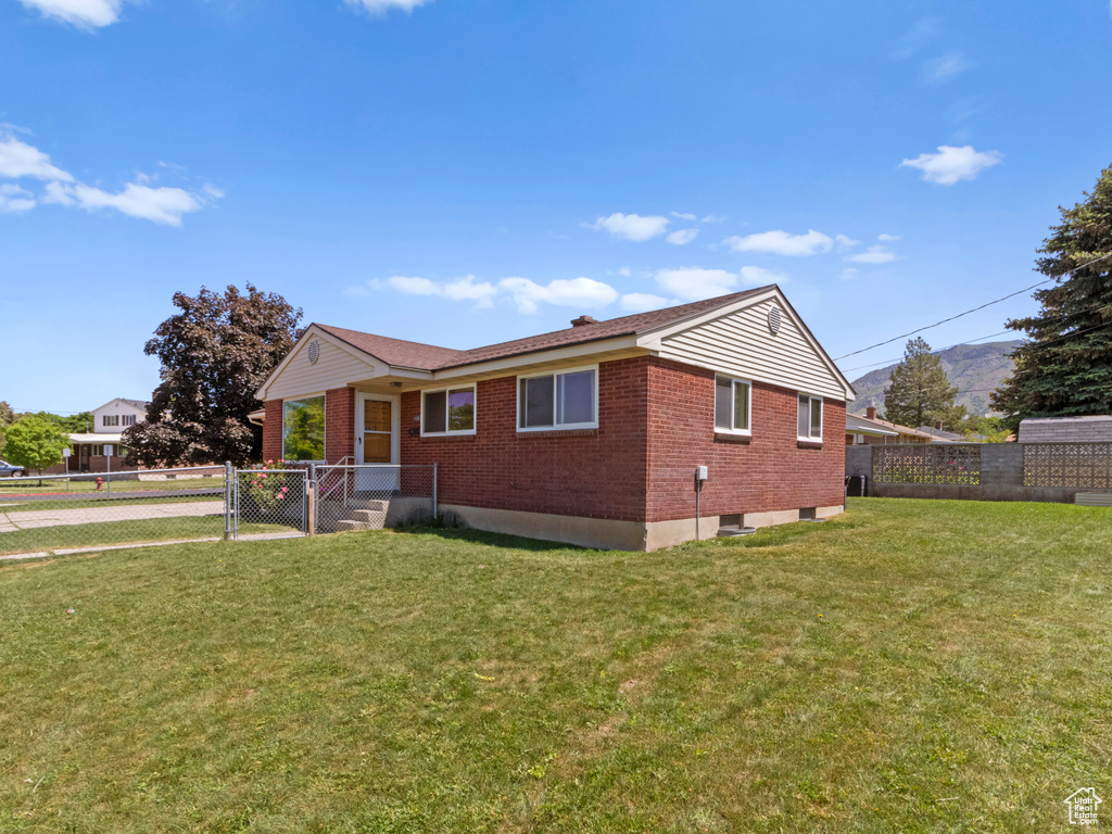 View of front of home featuring brick siding