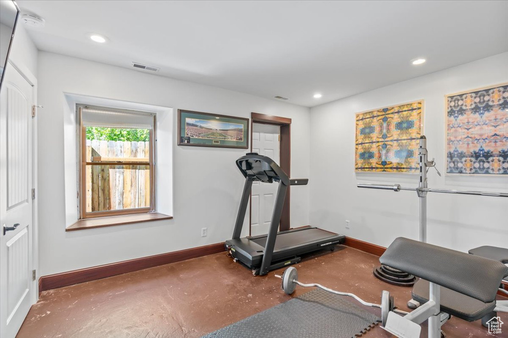 Workout room with baseboards and recessed lighting