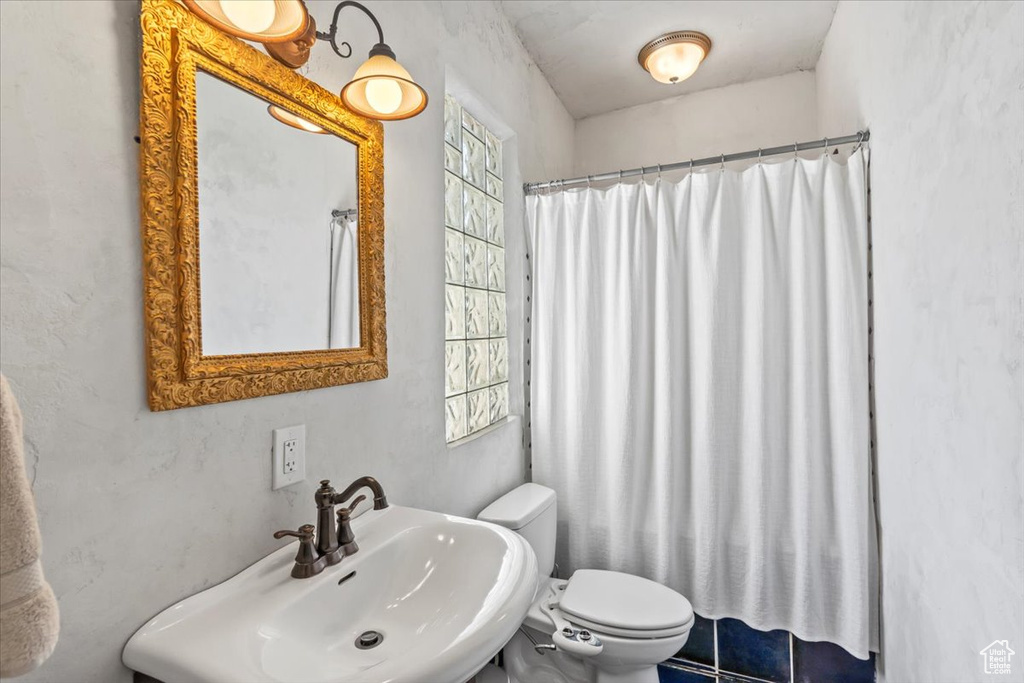 Full bathroom with a sink and toilet