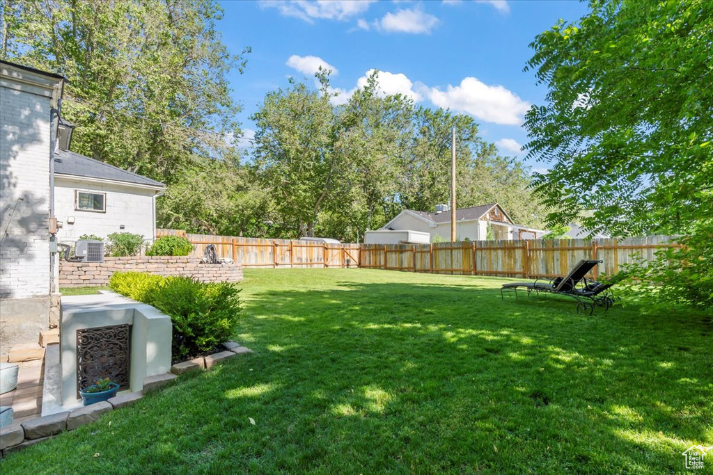View of yard with central AC