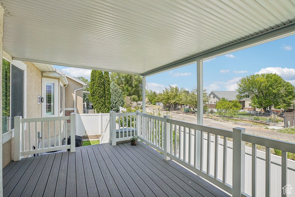 Wooden deck with a residential view