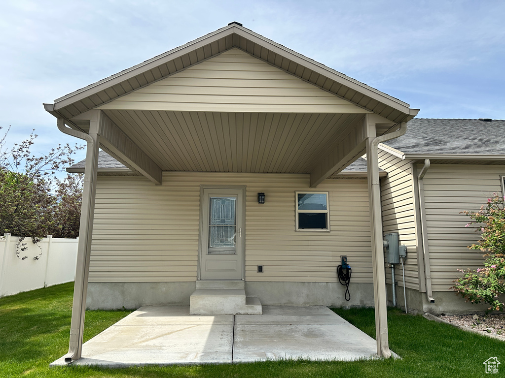 View of exterior entry featuring a patio