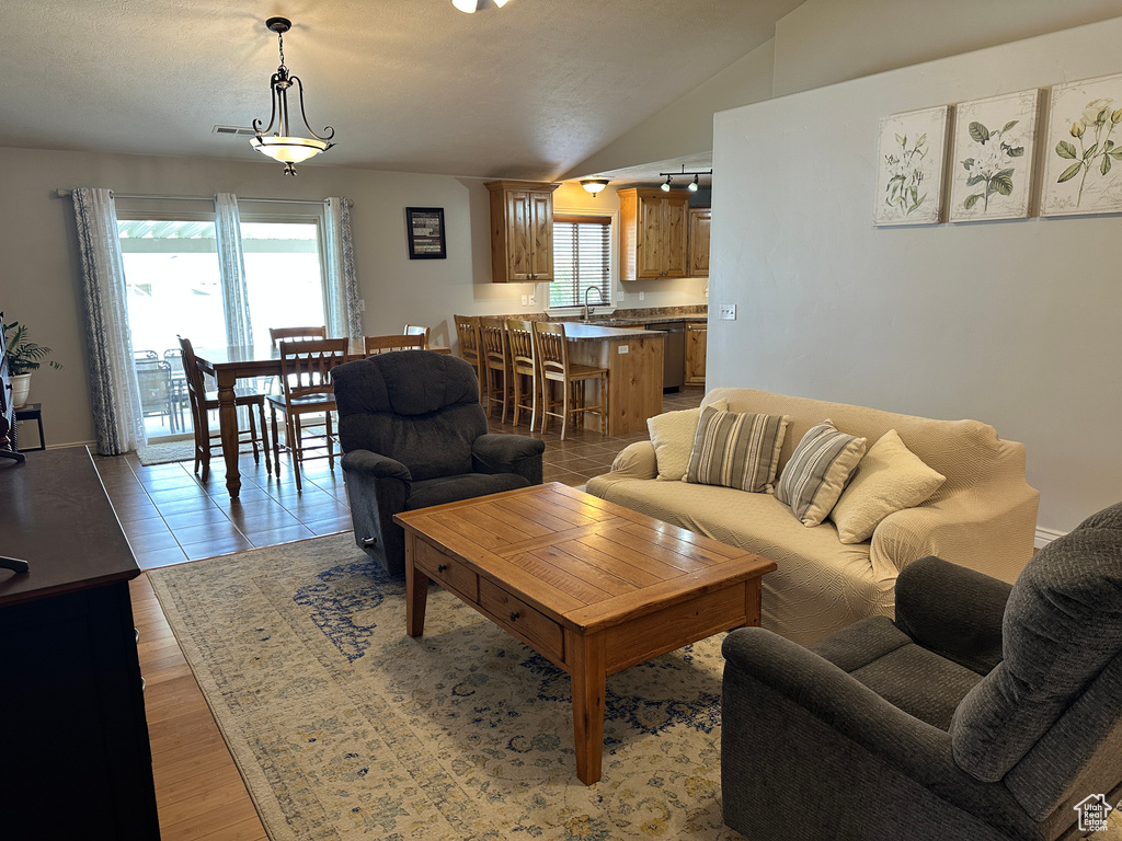 Living room featuring lofted ceiling