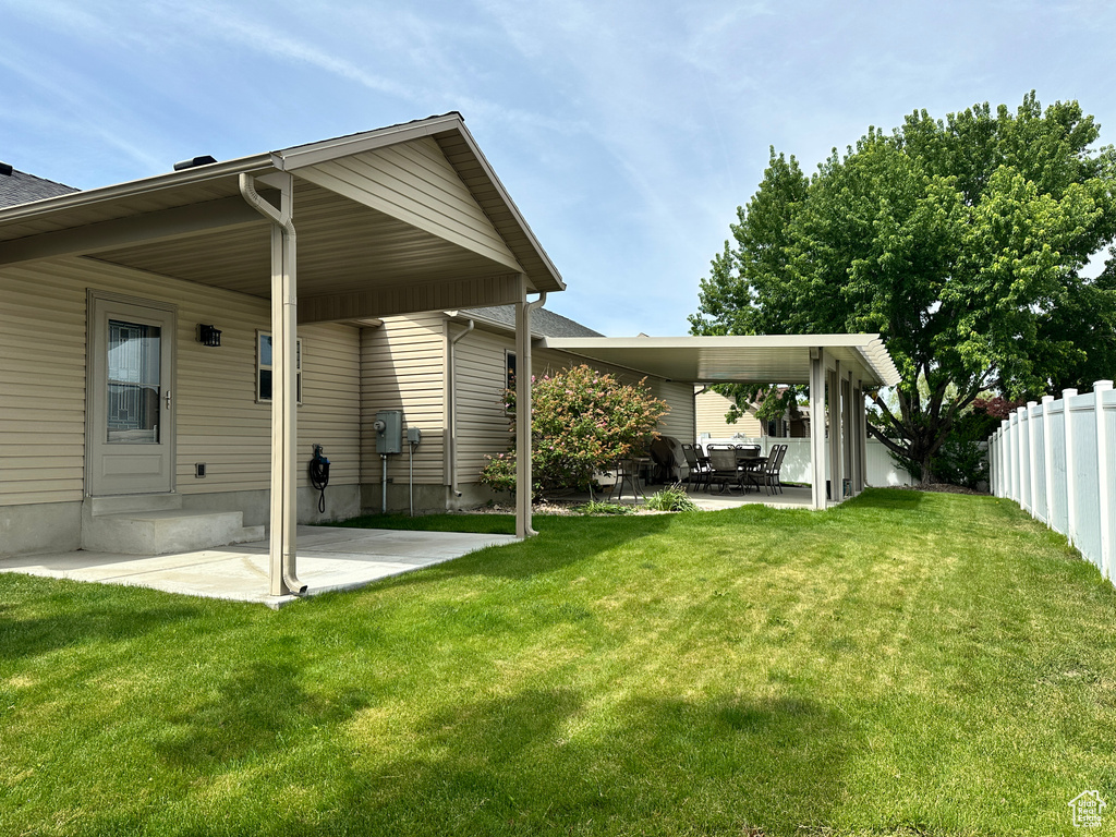 Rear view of house featuring a patio