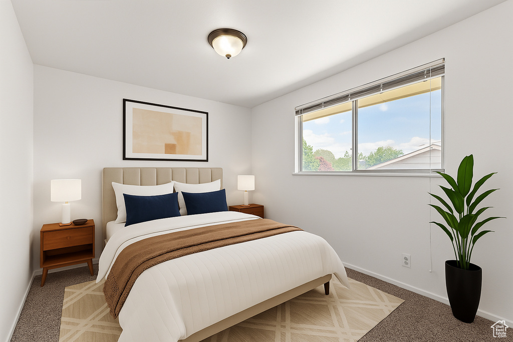 Bedroom featuring baseboards and carpet flooring