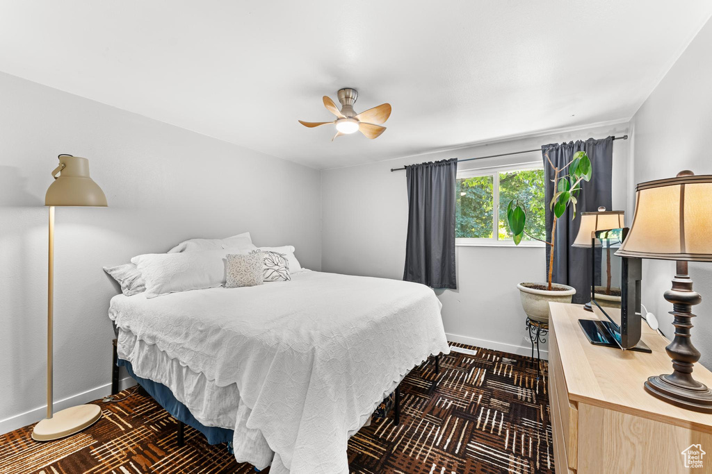 Bedroom with baseboards and a ceiling fan
