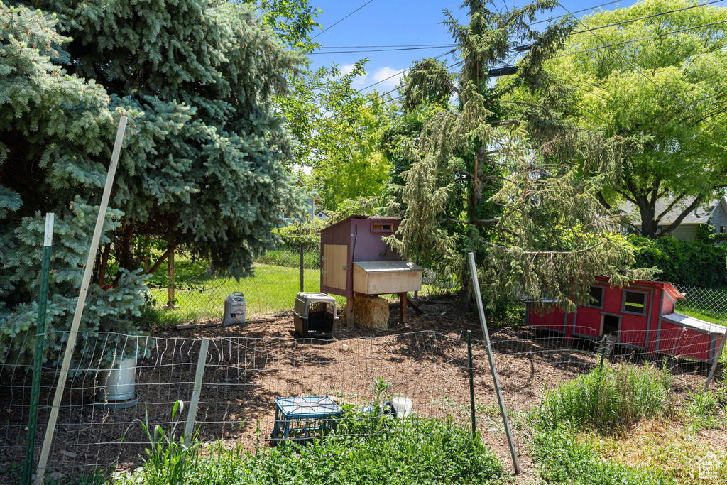 View of yard with exterior structure and an outdoor structure