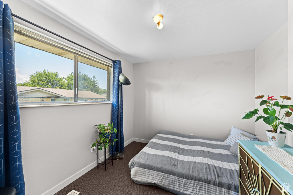Bedroom with carpet and baseboards