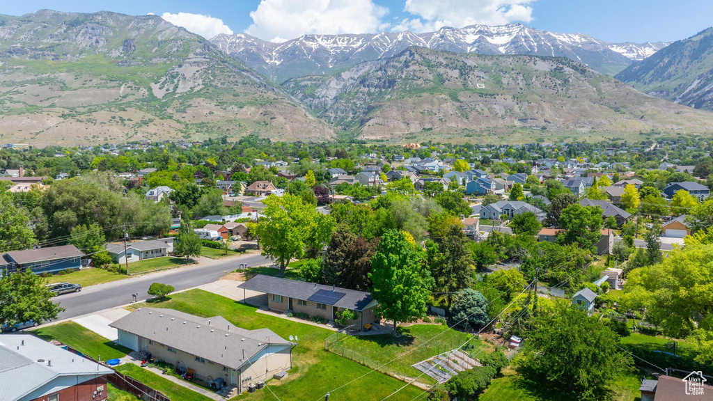 Aerial view of residential area featuring a mountain backdrop