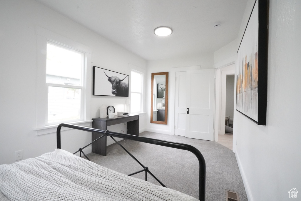 Carpeted bedroom with baseboards