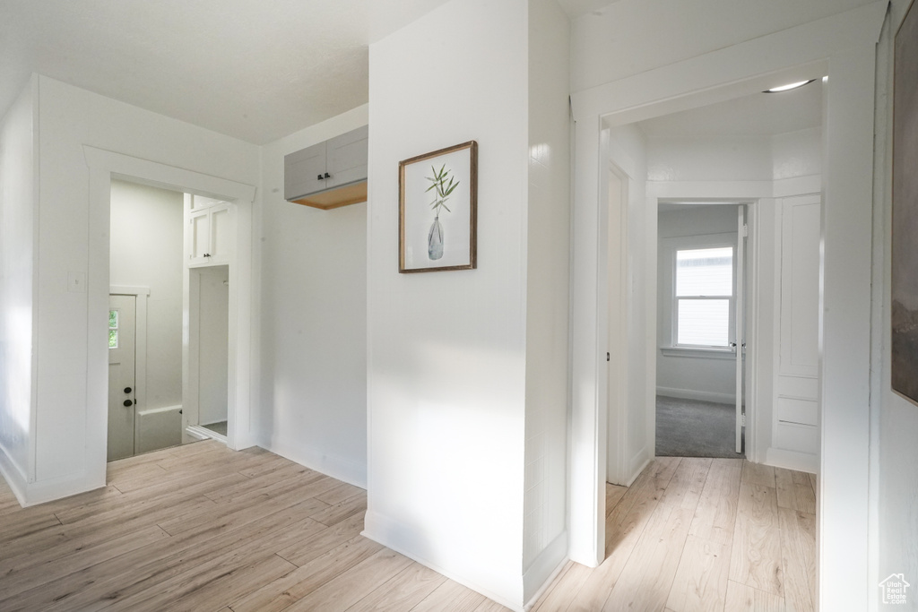 Corridor with light wood-type flooring