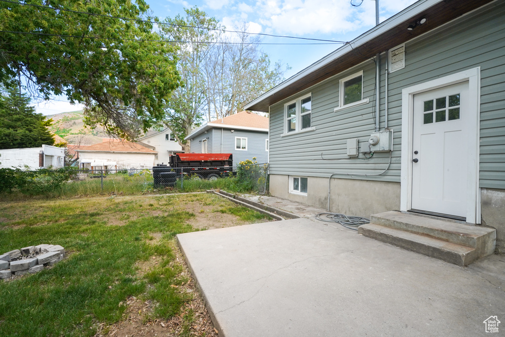 View of yard with a fire pit and a patio