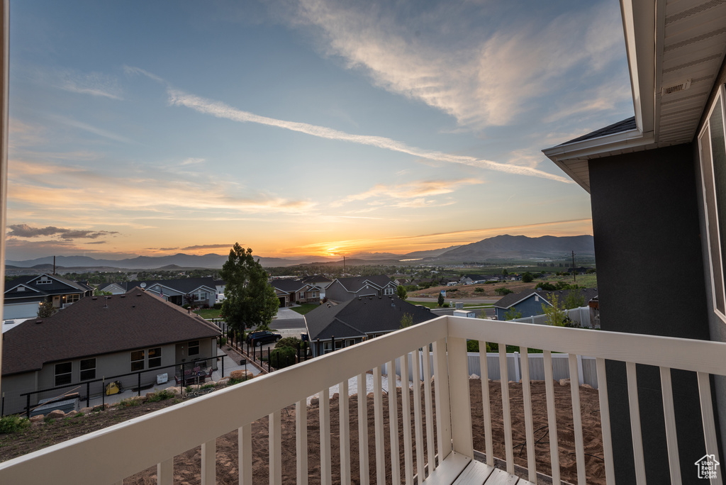 Balcony featuring a mountain view and a residential view