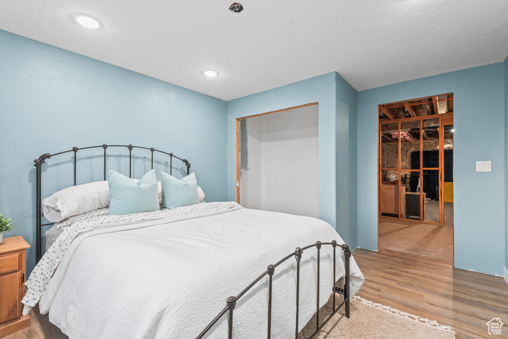 Bedroom featuring wood finished floors and recessed lighting