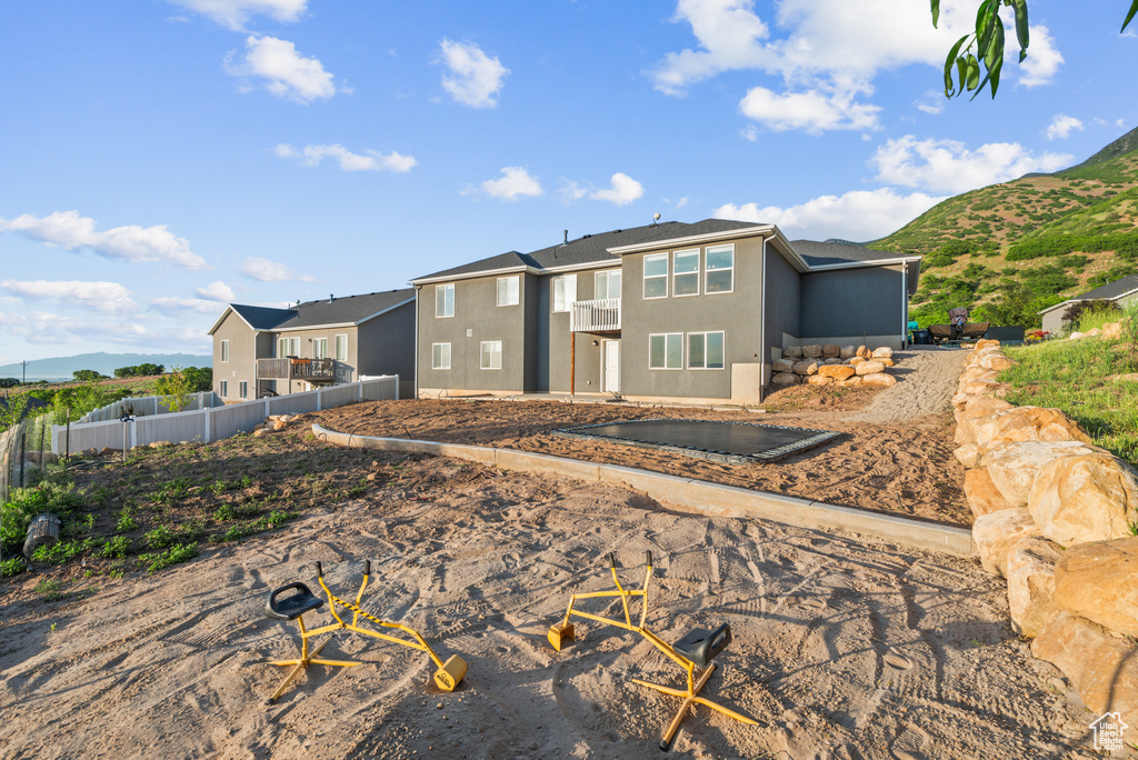 View of front of home with stucco siding and a mountain view