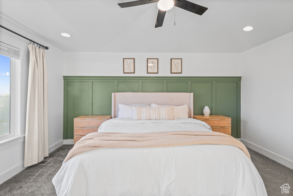 Bedroom with dark colored carpet, a ceiling fan, baseboards, and recessed lighting