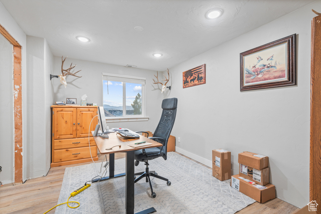 Office featuring light wood-style flooring, recessed lighting, and baseboards