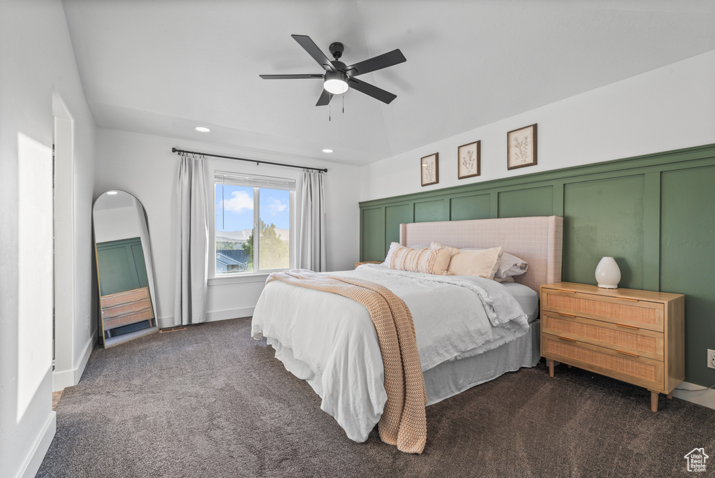 Bedroom featuring dark colored carpet, recessed lighting, and a ceiling fan
