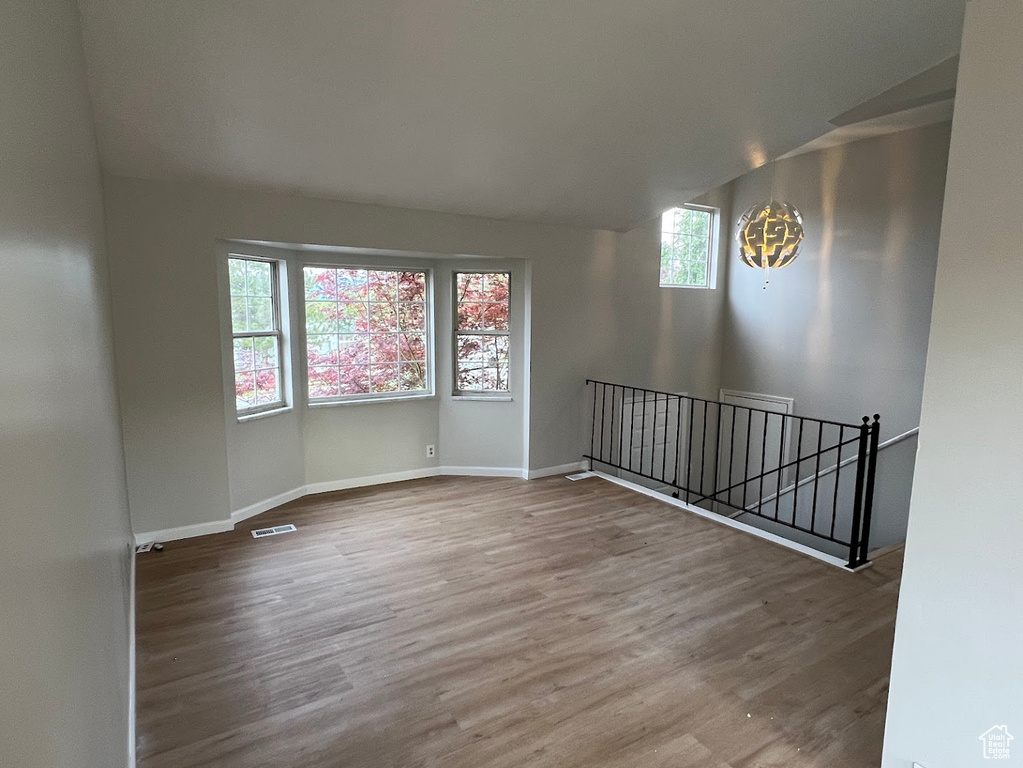 Empty room featuring wood finished floors and baseboards